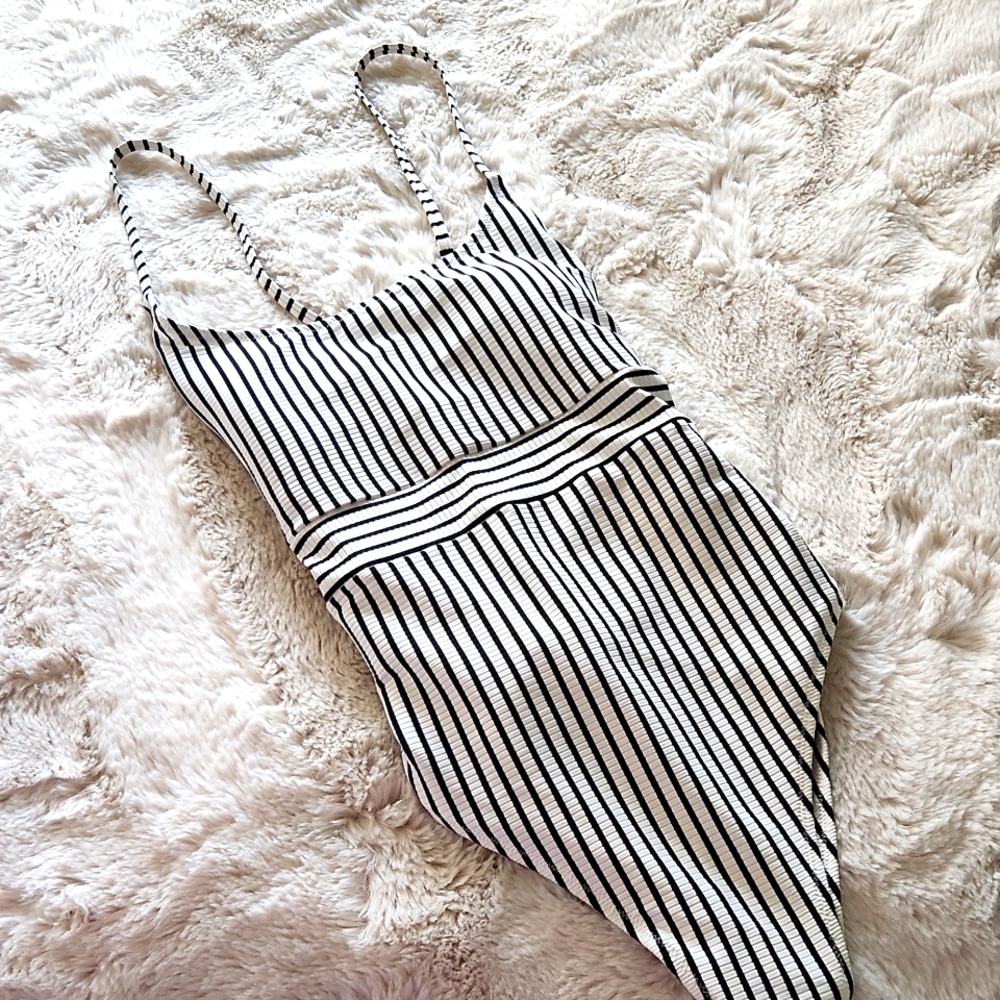 Stylish one-piece Black & White striped swimsuit.